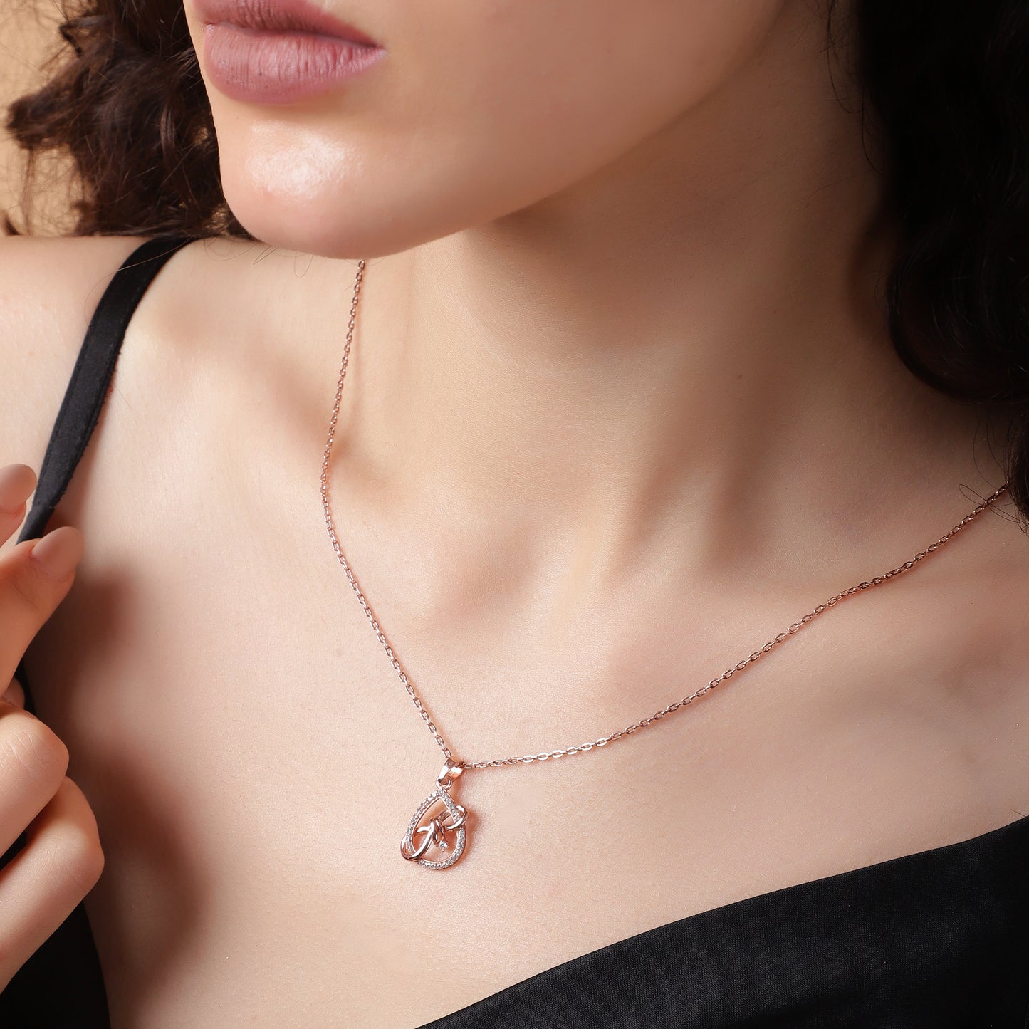 Graceful Embrace: Crystal-Trimmed Teardrop Pendant