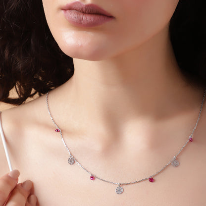 Dancing Medallions: Ruby & Silver Charm Station Necklace