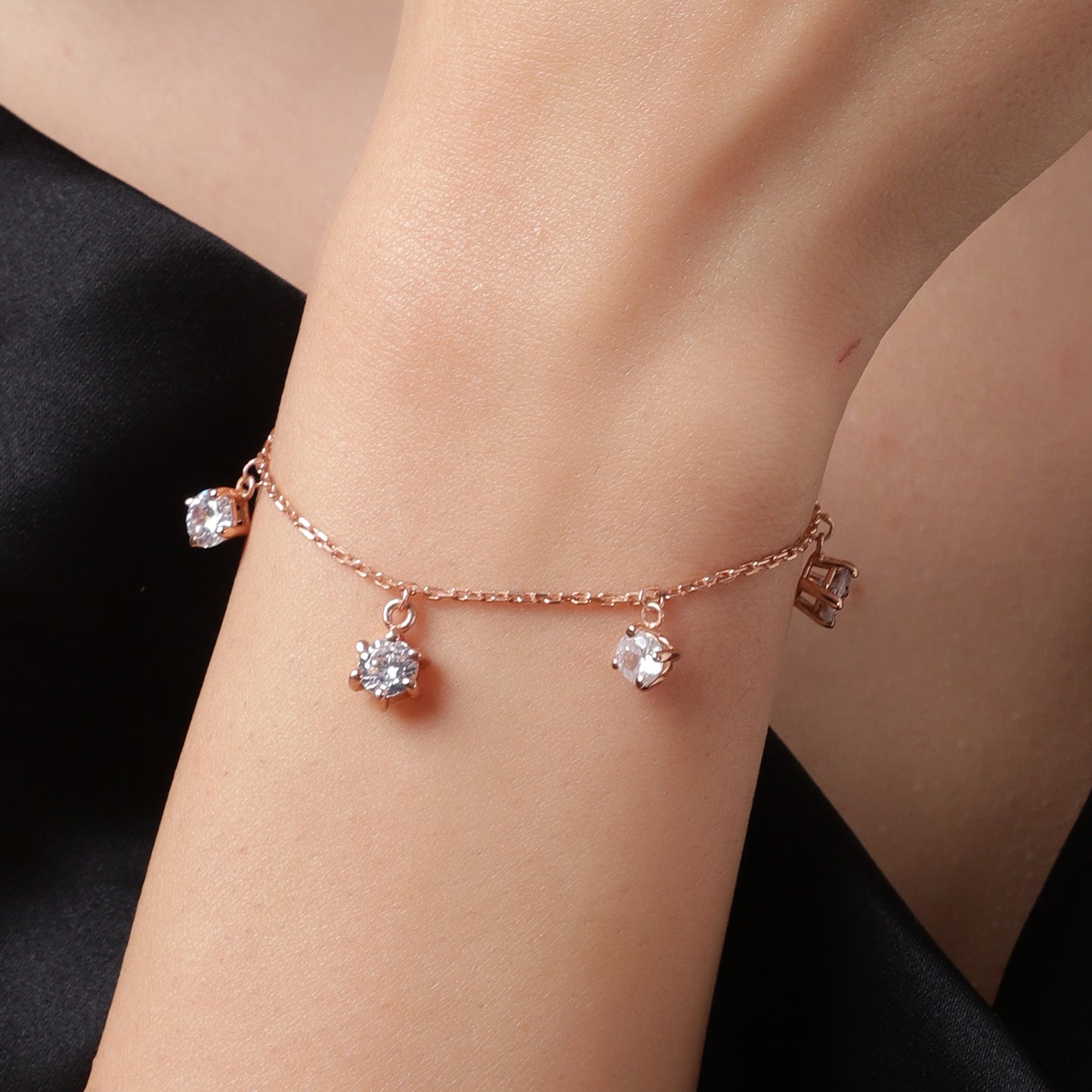 Dancing Diamonds: Rose Gold Charm Bracelet